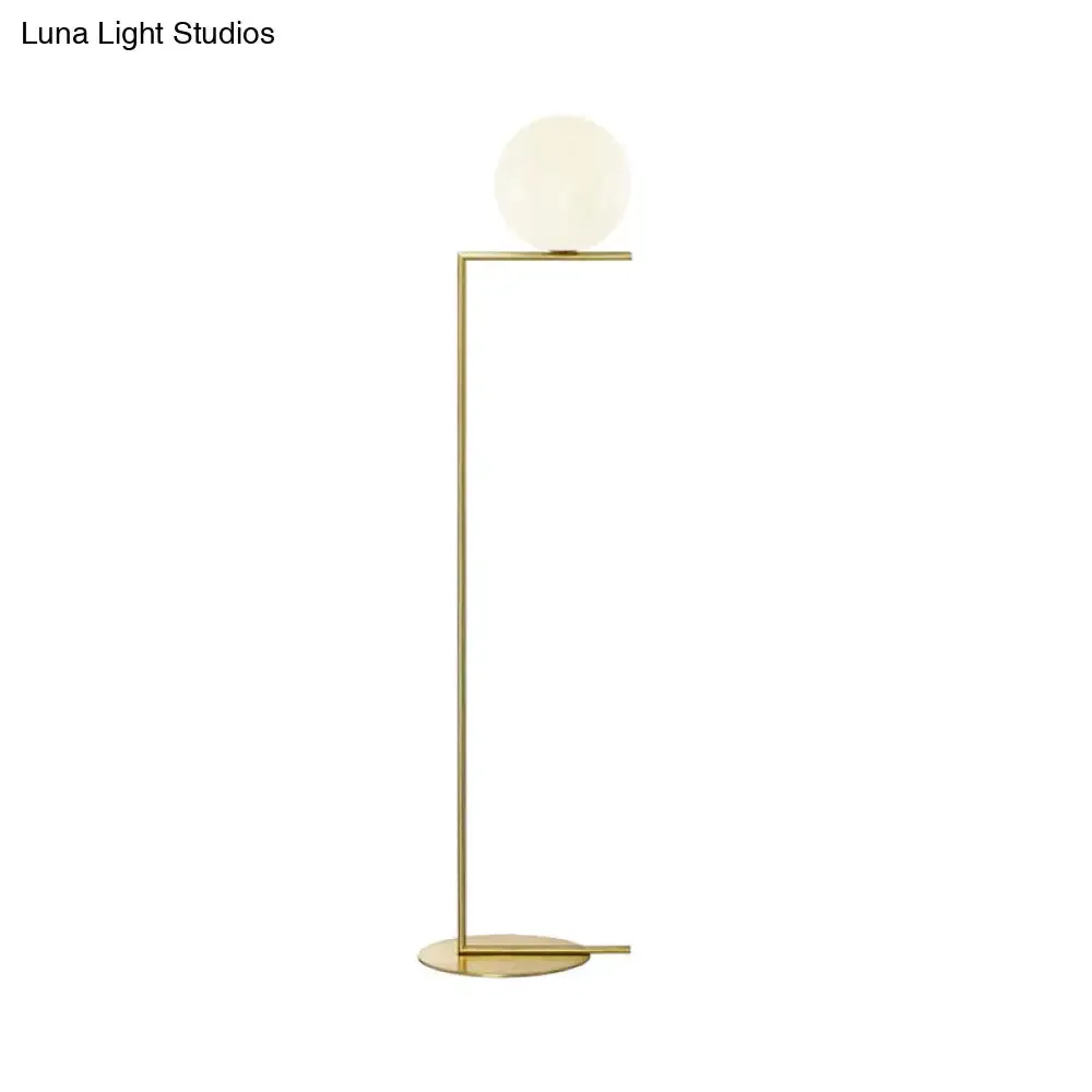 Minimalist Gold Orb Floor Lamp with Frosted Glass Shade and Right Angle Stand